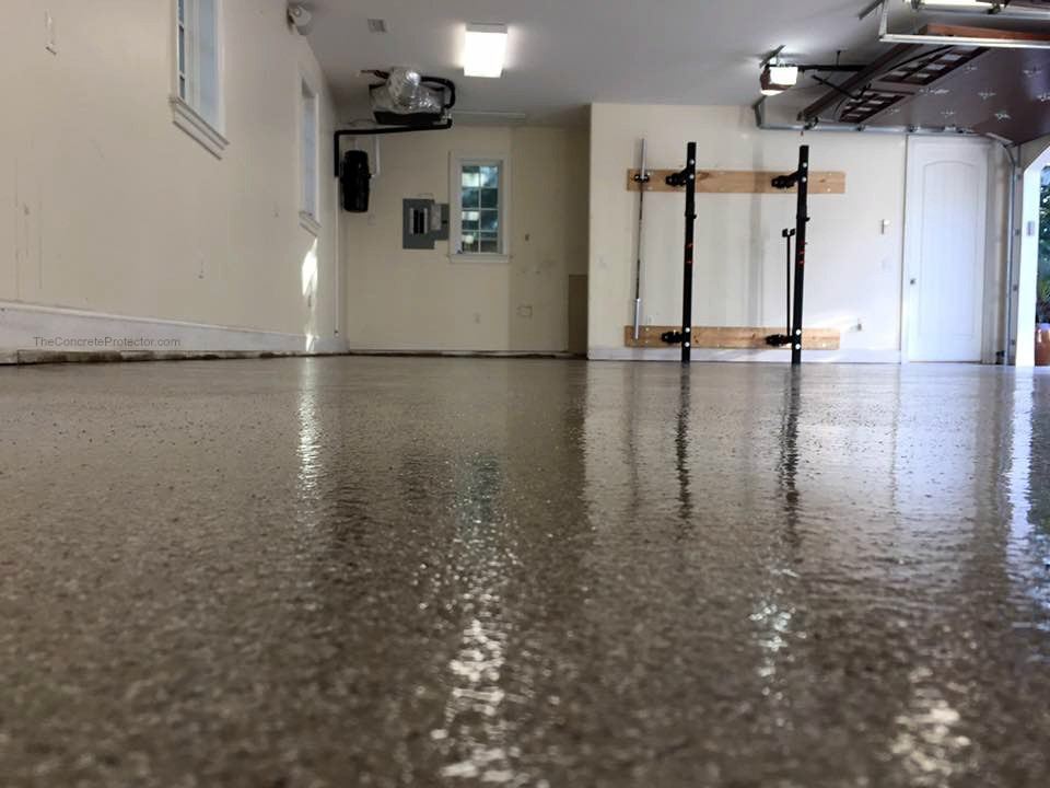 Full-broadcast flake coating covering a garage floor
